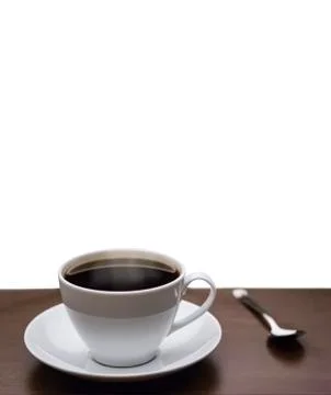 Cup of coffee on a table isolated on white Stock Photos