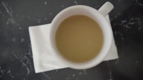 Cup of Coffee on table Napkin diner over head slow motion NJ 4K Stock Footage 274844361