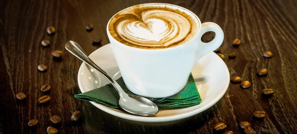 Cup of coffee on the table Stock Photos
