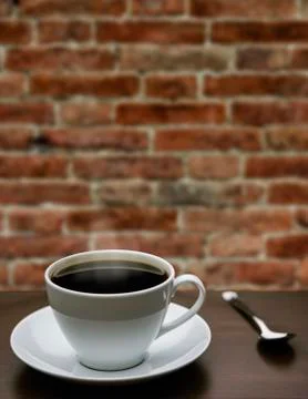 Cup of coffee on a table Stock Photos