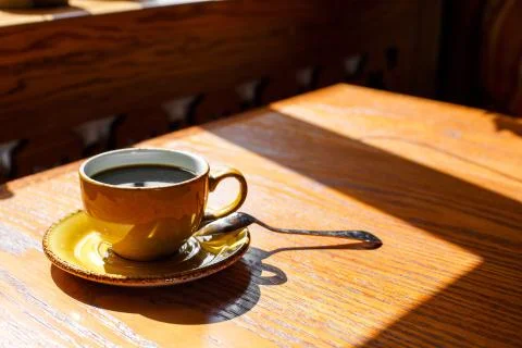A cup of coffee on the table Stock Photos