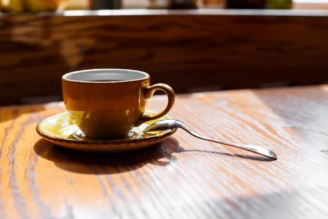 A cup of coffee on the table Stock Photos