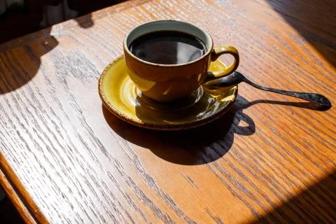 A cup of coffee on the table Stock Photos