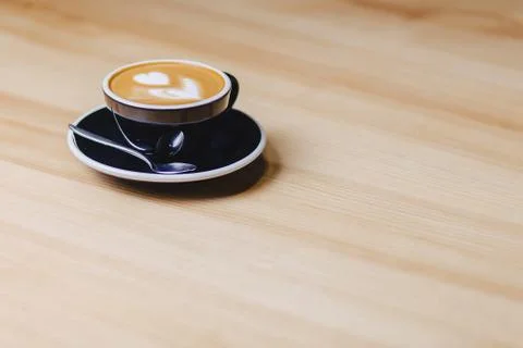 Cup of coffee on table Stock Photos