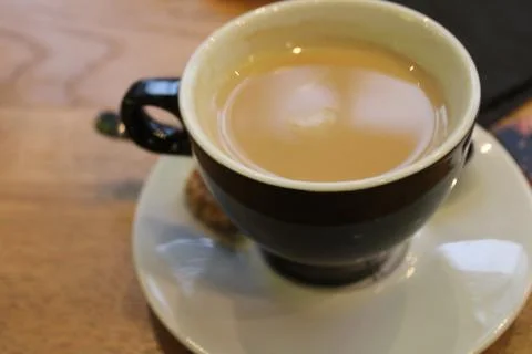 Cup of coffee on table Stock Photos