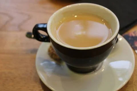 Cup of coffee on table Stock Photos