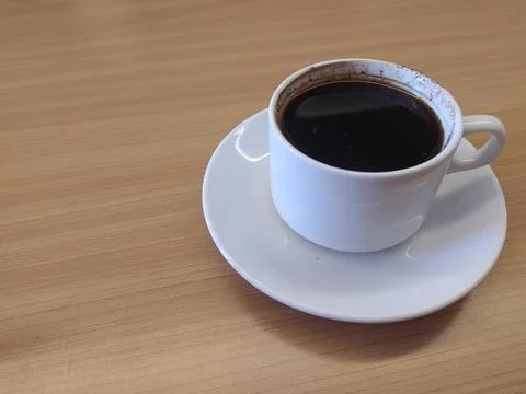Cup of coffee on the table Stock Photos