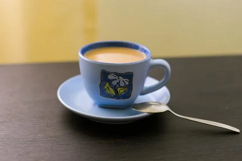 A cup of coffee on the table in the room 写真素材