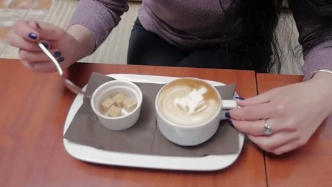 A cup of coffee on the table. Slow motion Stock Footage 77412629