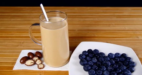 A cup of coffee on the table with sweets and pastries Stock Footage 143669057