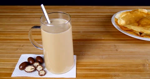 A cup of coffee on the table with sweets and pastries Stock Footage 143669386