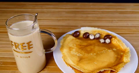 A cup of coffee on the table with sweets and pastries Stock Footage 143669574