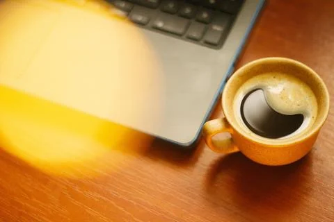 A cup of coffee on the tablemorning cup of coffee on an old tablecolored cup Stock Photos