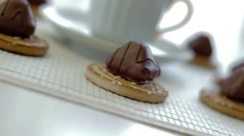 Cup of coffee with a thin captain and candies Stock Footage 22318991