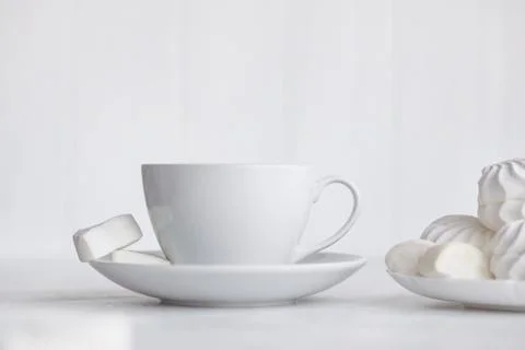 Cup of coffee on white background. Marshmallows Stock Photos