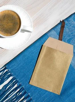 A cup of coffee on a white table. Stock Photos