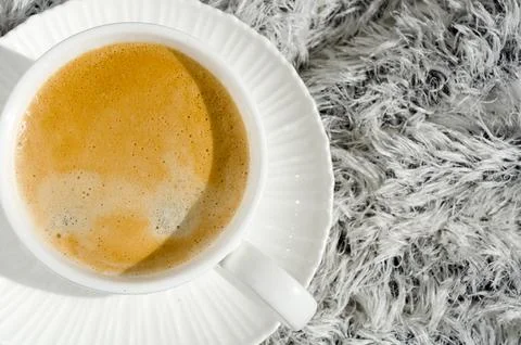 Cup of coffee on a white winter background. Stock Photos