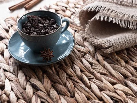 Cup with coffee on a wicker background Stock Photos
