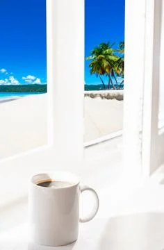 Cup of coffee on the window Photos