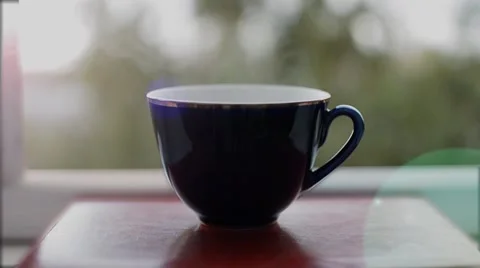 Cup of coffee on the window to smoke Stock Footage 55762307