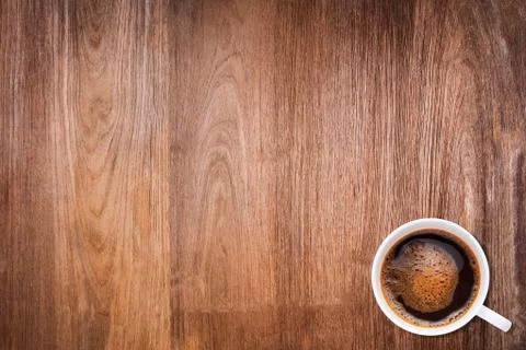 A cup of coffee on wood texture background Stock Photos
