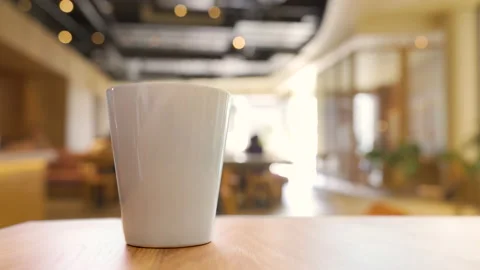 Cup of coffee on wooden table Stock Footage 148095254