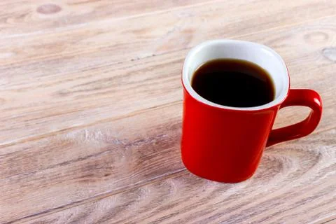 Cup of coffee on wooden table, top view Stock Photos