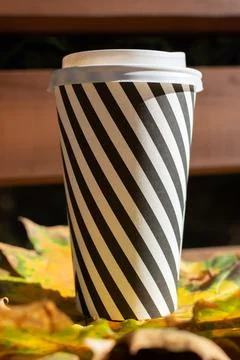 Cup of coffee on yellow maple leaf Stock Photos