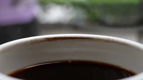 A cup of cooled down coffee over time. Waiting or relaxing. Video stock 113805947