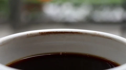 A cup of cooled down coffee over time. Waiting or relaxing. Stock Footage 113806214
