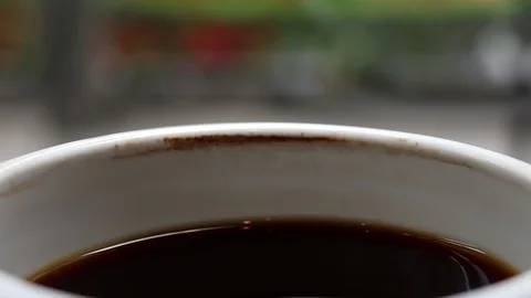 A cup of cooled down coffee over time. Waiting or relaxing. Stock Footage 113806260