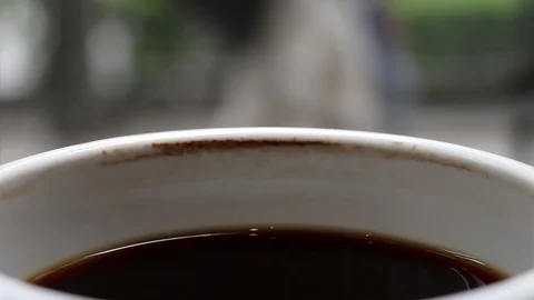 A cup of cooled down coffee over time. Waiting or relaxing. Stock Footage 113861368