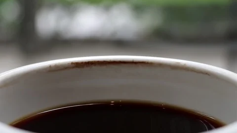 A cup of cooled down coffee over time. Waiting or relaxing. Stock Footage 114163518