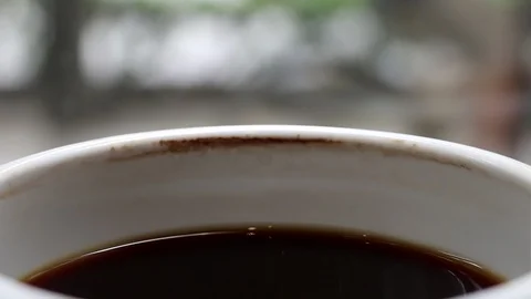 A cup of cooled down coffee over time. Waiting or relaxing. Stock Footage 114163704