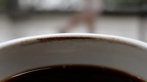 A cup of cooled down coffee over time. Waiting or relaxing. Stock Footage 114200208