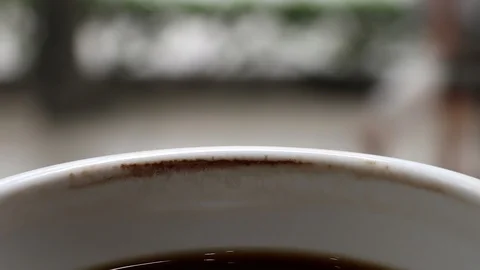 A cup of cooled down coffee over time. Waiting or relaxing. Stock Footage 114228752