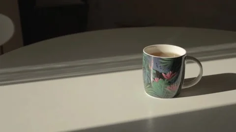 A cup of delicious aromatic hot tea stands on a white table Stock Footage 219508715