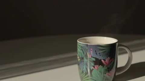 A cup of delicious aromatic hot tea stands on a white table Stock Footage 219508722