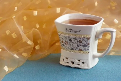 A cup of delicious flavored tea is on the table. Stock Photos