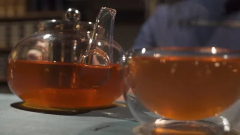 A cup of delicious, refreshing hot tea in a glass bowl Stock Footage 120537243