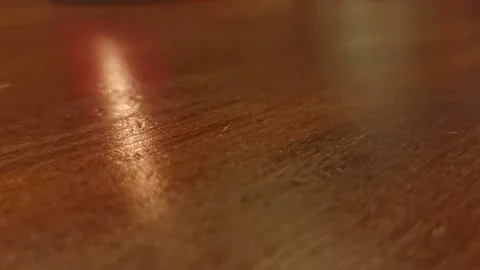 Cup of dice being turned over onto an interior wooden table while playing Stock Footage 175324669