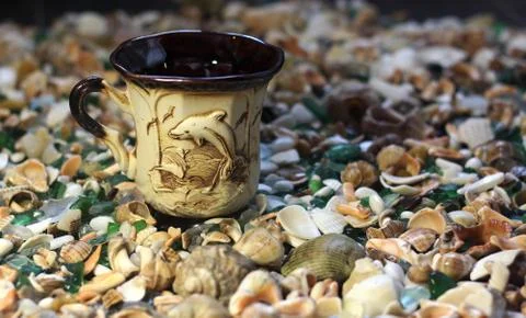 Cup with dolphin Stock Photos