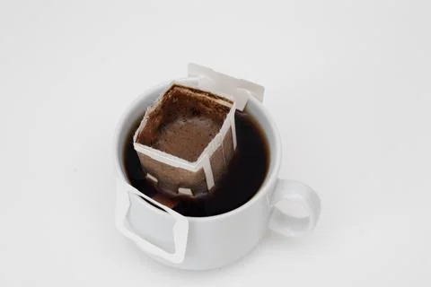 Cup with drip coffee bag Stock-Fotos