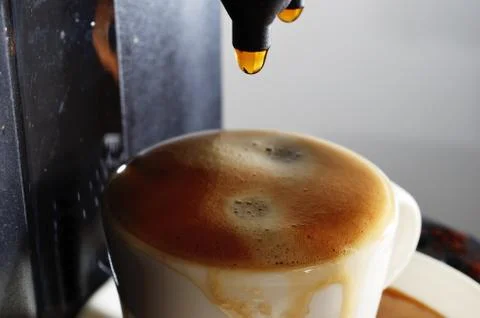 Cup of espresso and coffee machine Stock Photos