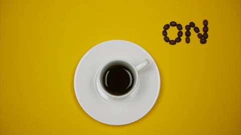 A cup of espresso with ON OFF buttons on yellow background Vídeos de archivo 124662998
