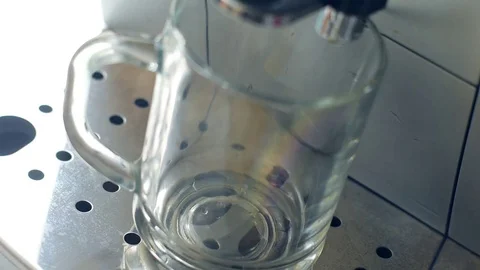 A Cup of espresso in coffee machine Stock Footage 73698866