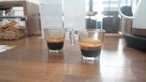 Cup of espresso coffee on wooden table Stock Footage 236903299