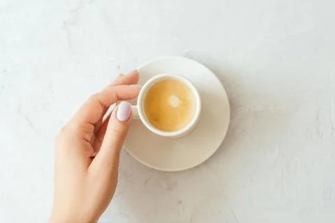 A cup of espresso on a gray background. Stock Photos