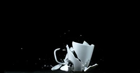 Cup falling and exploding on Black Background 스톡 사진