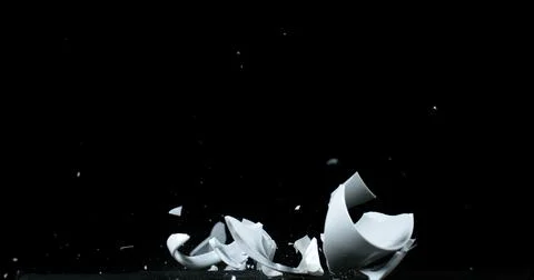 Cup falling and exploding on Black Background 写真素材